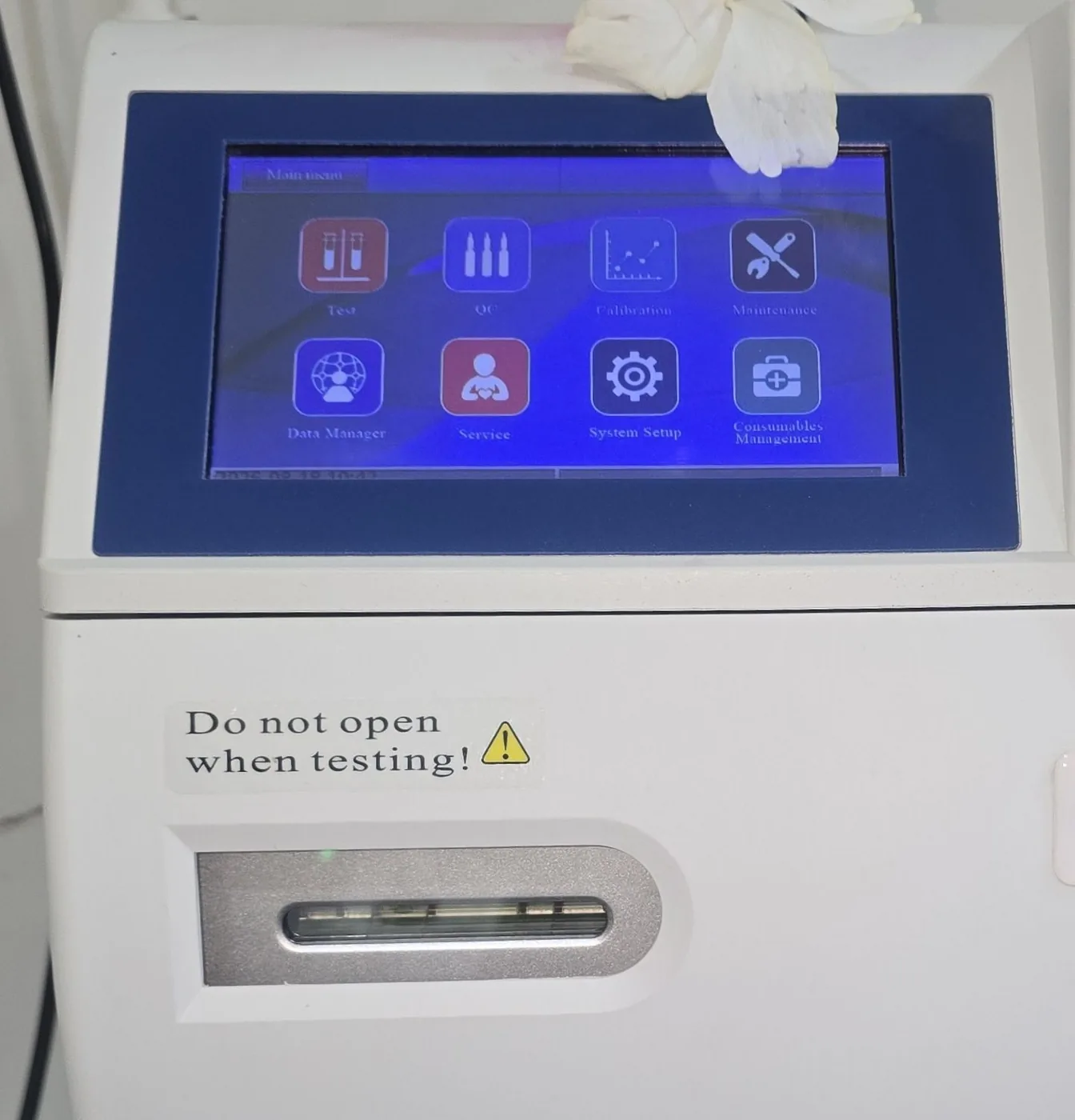 The AFT 800 electrolyte analyser, its menu open on the touchscreen